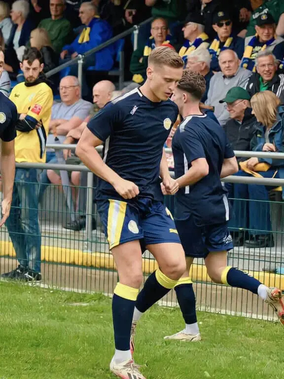 Football Training Kit and Teamwear | Players Warming Up. Design it. Wear it. Custom football kits delivered by SWAZ.